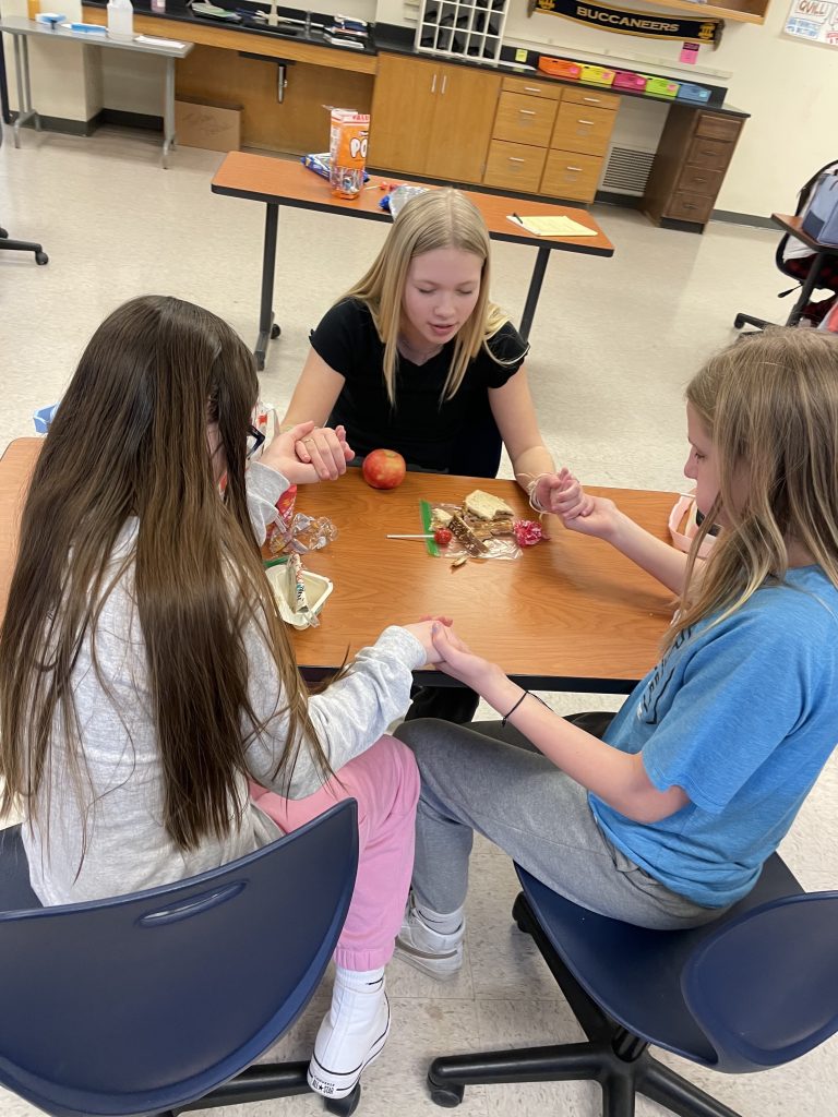 students praying